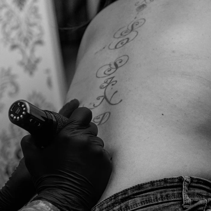 script-lettering-back-tattoo-outline-process